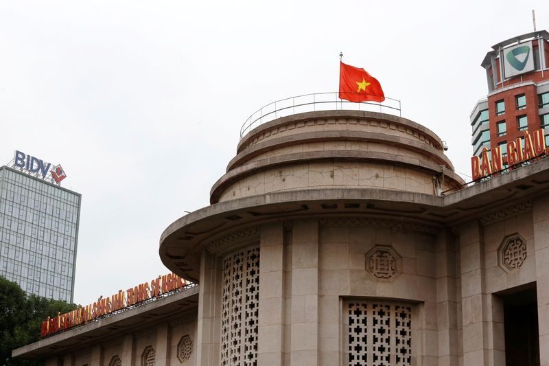 &copy; Reuters. FILE PHOTO: A Vietnamese flag flies atop the State Bank building, near the Vietcombank and Bank for Investment and Development of Vietnam buildings, in central Hanoi, Vietnam November 23, 2017. REUTERS/Kham/File Photo