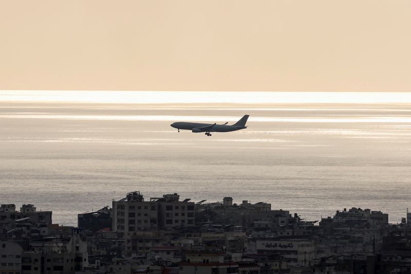 © Reuters. An aircraft flies over Beirut, amid the ongoing hostilities between Hezbollah and Israeli forces, in Beirut, Lebanon October 7, 2024. REUTERS/Mohamed Azakir/File Photo