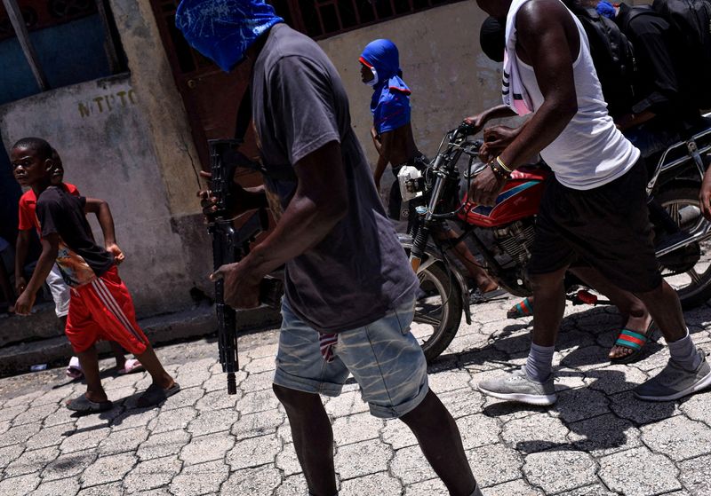 &copy; Reuters. FILE PHOTO: Children accompany armed gang members in a march organised by former police officer Jimmy "Barbecue" Cherizier, leader of an alliance of armed groups, in the Delmas neighbourhood, in Port-au-Prince, Haiti, May 10, 2024/REUTERS/Pedro Valtierra 