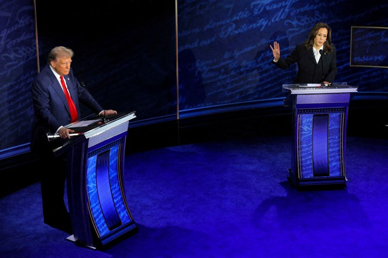 &copy; Reuters. FILE PHOTO: Democratic presidential nominee, U.S. Vice President Kamala Harris, speaks during a presidential debate hosted by ABC as Republican presidential nominee, former U.S. President Donald Trump, listens, in Philadelphia, Pennsylvania, U.S., Septemb