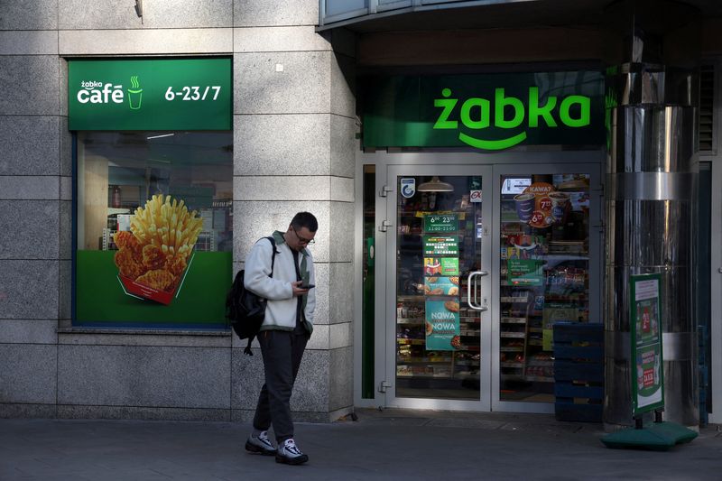 &copy; Reuters. FILE PHOTO: A man stands in front of the Zabka's store in Warsaw, Poland, October 1, 2024. REUTERS/Kacper Pempel/File Photo