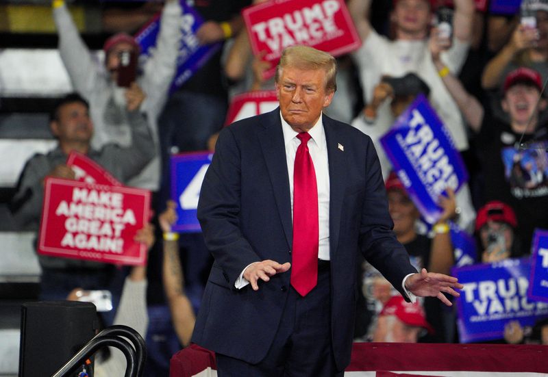 © Reuters. FILE PHOTO: Republican presidential nominee and former U.S. President Donald Trump gestures during a campaign rally in Reading, Pennsylvania, U.S. October 9, 2024. REUTERS/Jeenah Moon/File Photo