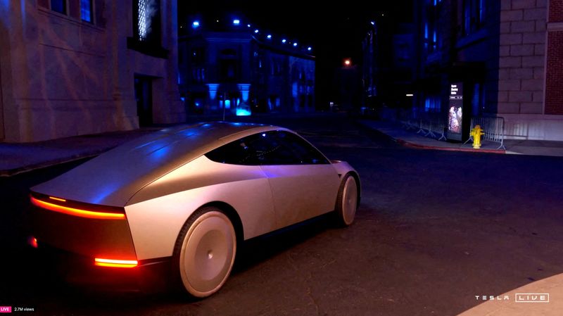 © Reuters. Tesla CEO and X owner Elon Musk rides in Tesla's robotaxi at an unveilling event in Los Angeles, California, U.S. October 10, 2024 in this still image taken from video. Tesla/Handout via REUTERS    