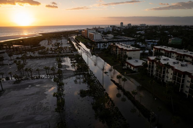 &copy; Reuters. FILE PHOTO: A drone view shows a flooded and damaged area following Hurricane Milton in Siesta Key, Florida, U.S., October 10, 2024.  REUTERS/Marco Bello/File Photo