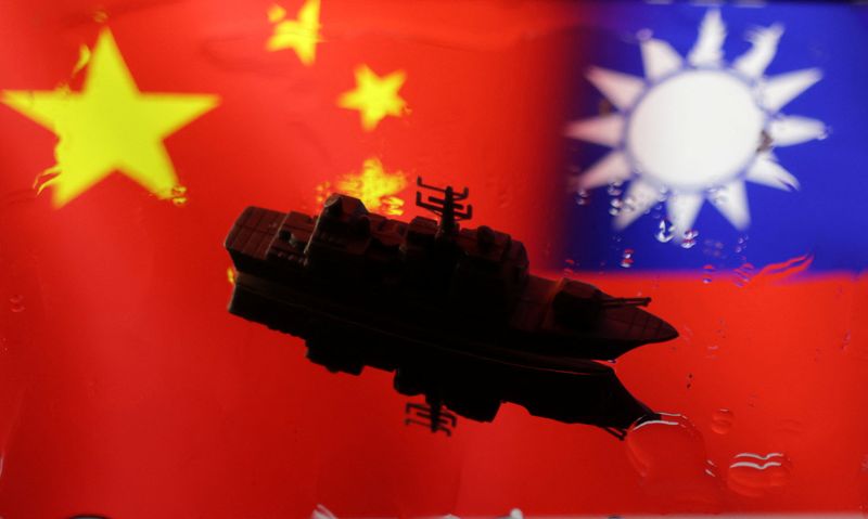 &copy; Reuters. FILE PHOTO: A Navy miniature is seen in front of displayed Chinese and Taiwanese flags in this illustration taken, April 11, 2023. REUTERS/Dado Ruvic/Illustration/FIle Photo