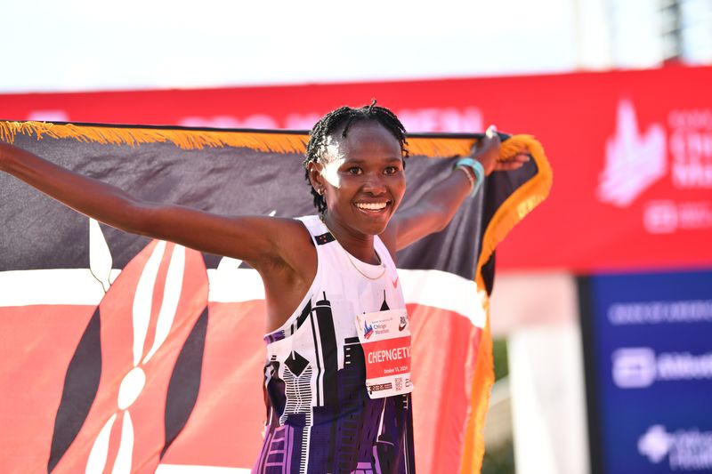 &copy; Reuters. Oct 13, 2024; Chicago, IL, USA; Ruth Chepngetich of Kenya celebrates after finishing first in the women’s race, setting a new world record at 2:09:56 during the Chicago Marathon at Grant Park. Mandatory Credit: Patrick Gorski-Imagn Images