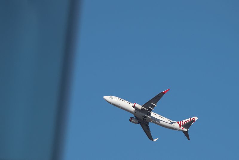 &copy; Reuters. FILE PHOTO: A Virgin Australia Airlines plane takes off from Kingsford Smith International Airport in Sydney, Australia, March 18, 2020.  REUTERS/Loren Elliott/ File photo