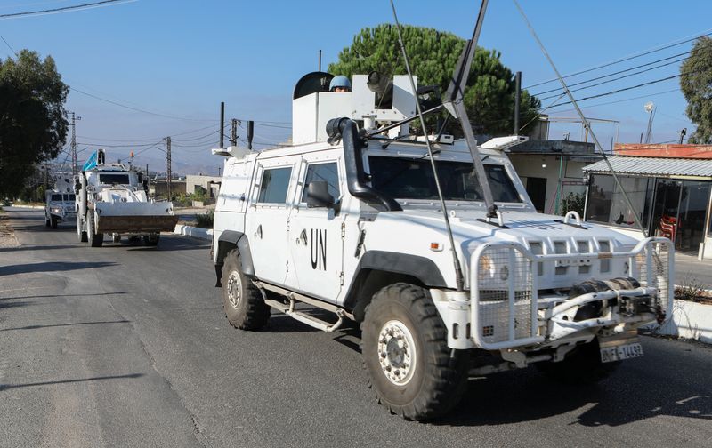 © Reuters. UN peacekeepers (UNIFIL) vehicles drive in Marjayoun, near the border with Israel, amid ongoing hostilities between Hezbollah and Israeli forces, southern Lebanon October 11, 2024. REUTERS/Karamallah Daher/File Photo