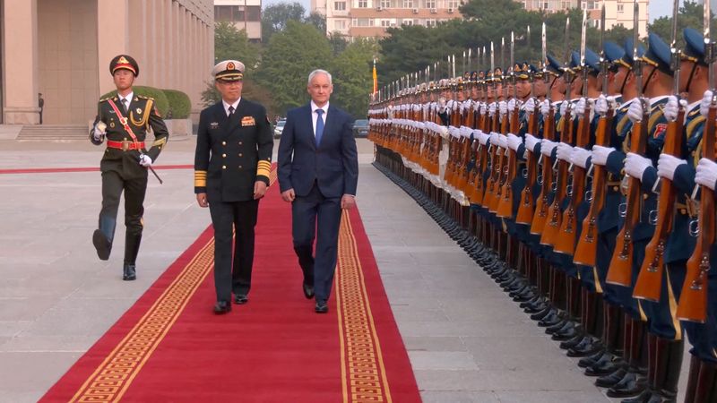 © Reuters. FILE PHOTO: Russian Defence Minister Andrei Belousov and Chinese Defence Minister Dong Jun attend a welcoming ceremony in Beijing, China, in this still image taken from video released on October 14, 2024. Russian Defence Ministry/Handout via REUTERS/File Photo