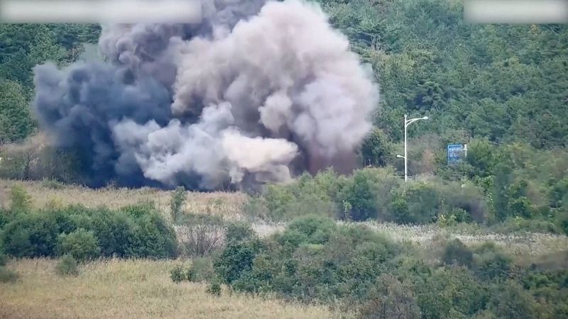 © Reuters. Smoke rises after North Korea blows up sections of inter-Korean roads on its side of the border between the two Koreas, according to South Korea's military, as seen from the South Korean side, October 15, 2024, in this screen grab from a handout video. South Korean Defence Ministry/Handout via REUTERS