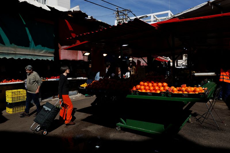 Shopping at Carmel Market amid ongoing conflict in Tel Aviv