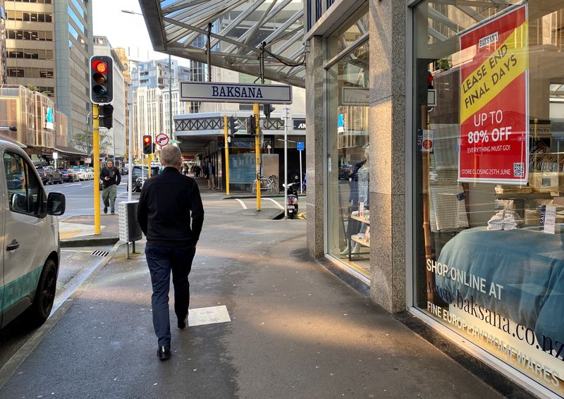 &copy; Reuters. A man walks past stores at the main shopping district, in Wellington, New Zealand June 18, 2024. REUTERS/Lucy Craymer/ File Photo