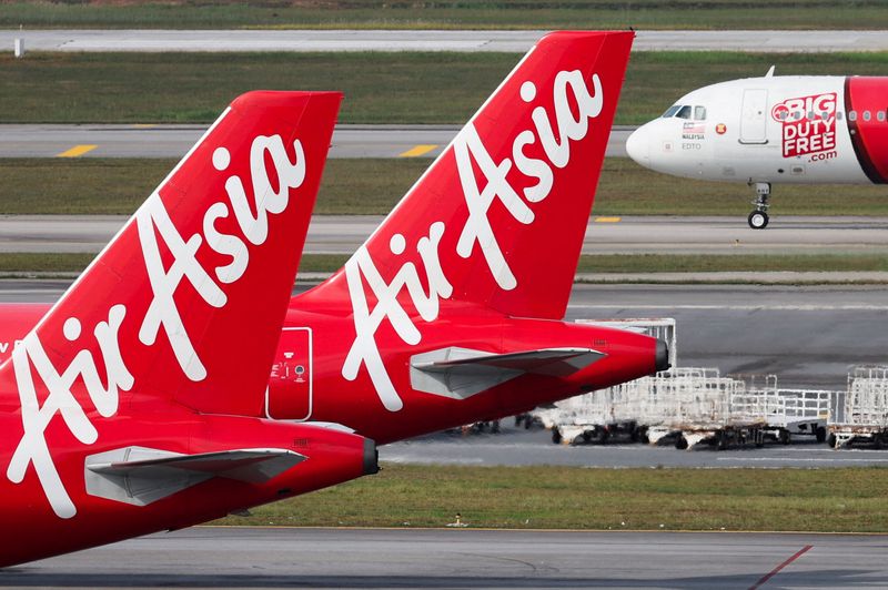 &copy; Reuters. FILE PHOTO: Planes from AirAsia, a subsidiary airline of Capital A, are seen on the tarmac of Kuala Lumpur International Airport Terminal 2 (KLIA2) in Sepang, Malaysia, February 26, 2024. REUTERS/Hasnoor Hussain/File Photo