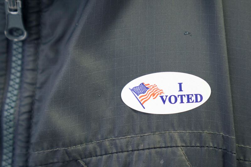 © Reuters. A file photo of a voter wearing an 'I voted' sticker at a polling station. April 2, 2024. REUTERS/Erica Dischino/File Photo