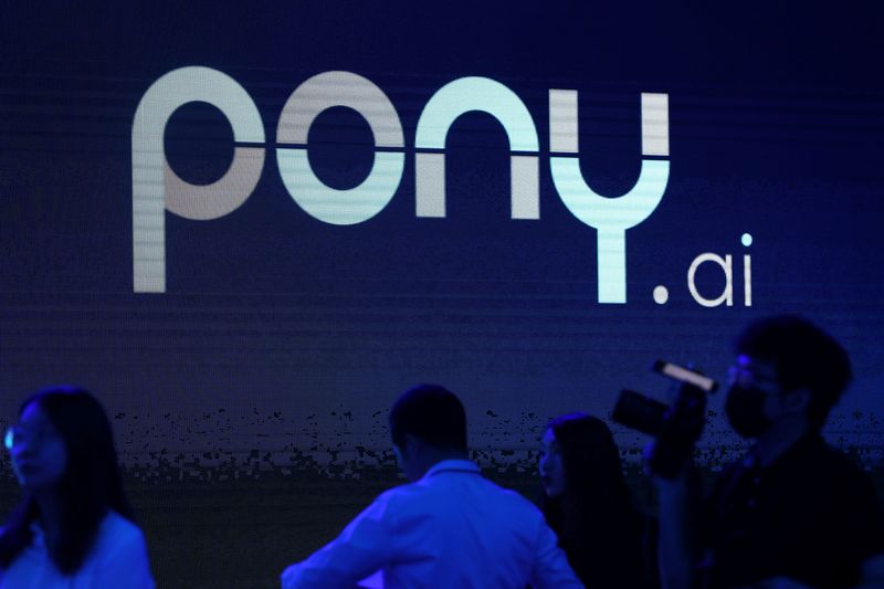 &copy; Reuters. A logo of the autonomous driving technology startup Pony.ai is seen on a screen during an event in Beijing, China May 13, 2021. REUTERS/Tingshu Wang/ File Photo