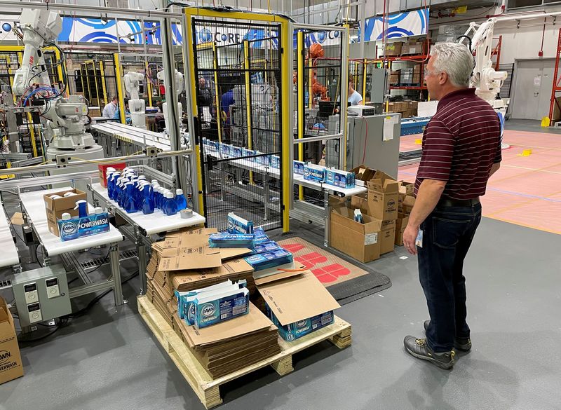 &copy; Reuters. A researcher at Procter & Gamble's CoRE Fabric and Home Care Robotics Laboratory tests a new robot for handling cleaning products on the company's assembly lines, in Cincinnati, Ohio, U.S., May 27, 2021. Picture taken May 27, 2021. REUTERS/Timothy Aeppel/