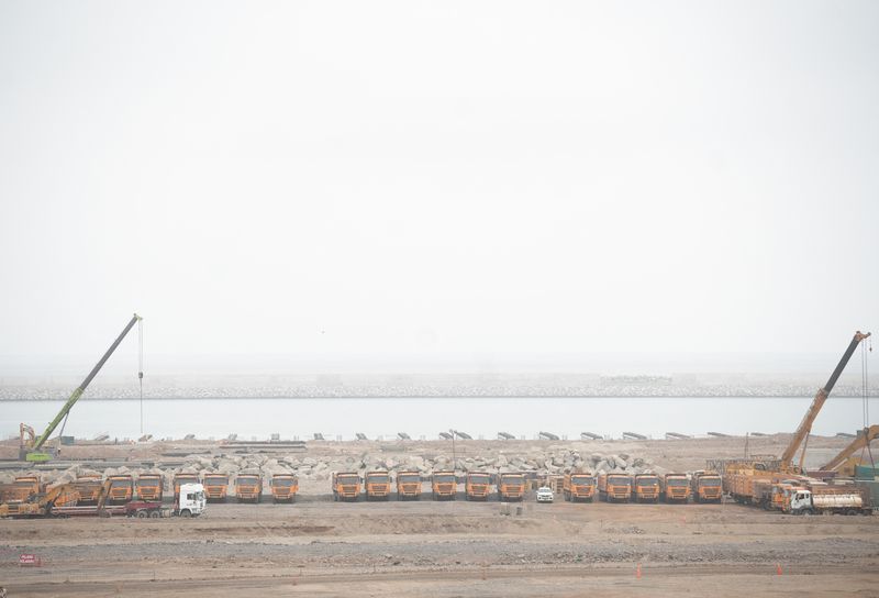 &copy; Reuters. Trucks are parked at the construction site of a new Chinese mega port, in Chancay, Peru August 22, 2023. REUTERS/Angela Ponce/ File Photo