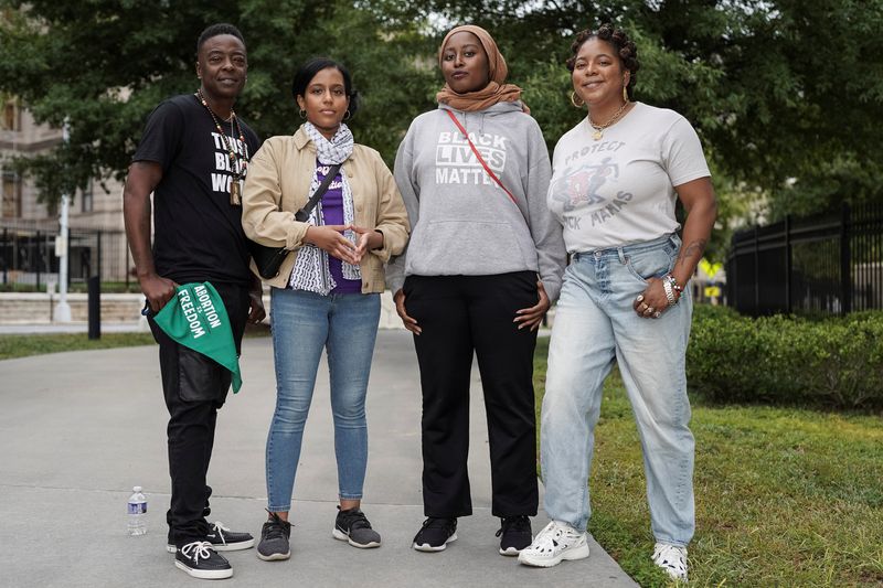 &copy; Reuters. Feminist Women's Health Center employees Sincere Porter, Naomi Desta-Bell, Habeebah Yasin and Kwajelyn Jackson pose for a portrait following a vigil and rally for abortion rights and in response to the deaths of Amber Nicole Thurman and Candi Miller, who 