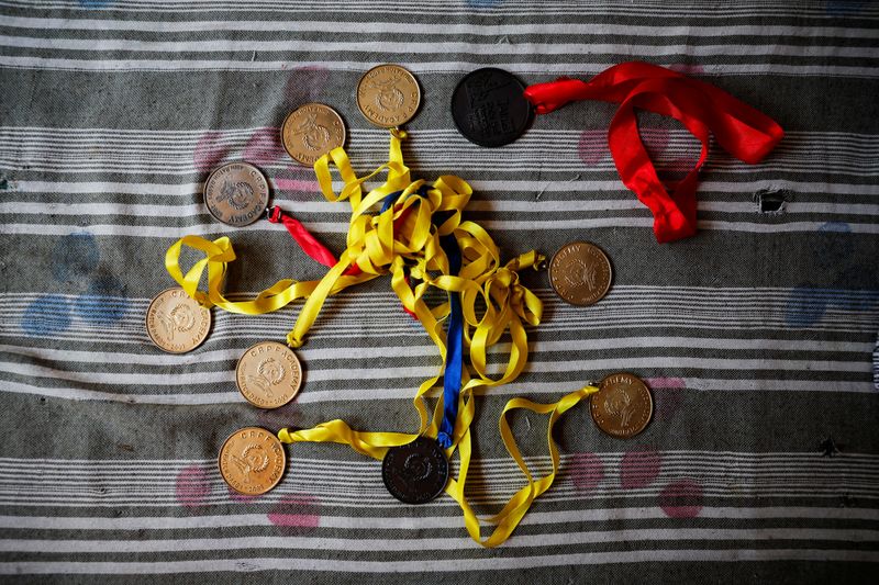 © Reuters. Medals awarded to Vikash Yadav, Pranpura village, Haryana, India, October 19, 2024. REUTERS/Anushree Fadnavis