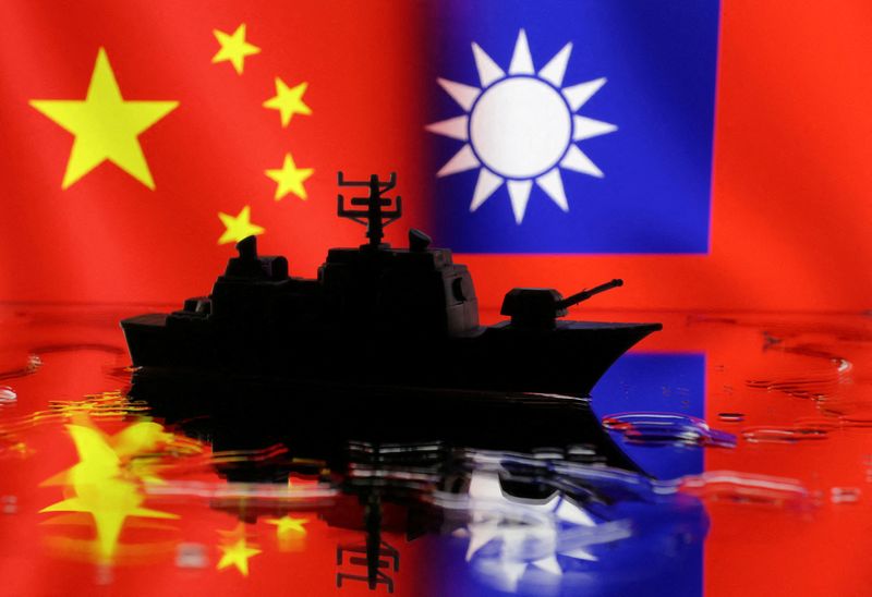 © Reuters. FILE PHOTO: A Navy miniature is seen in front of displayed Chinese and Taiwanese flags in this illustration taken, April 11, 2023. REUTERS/Dado Ruvic/Illustration/File Photo