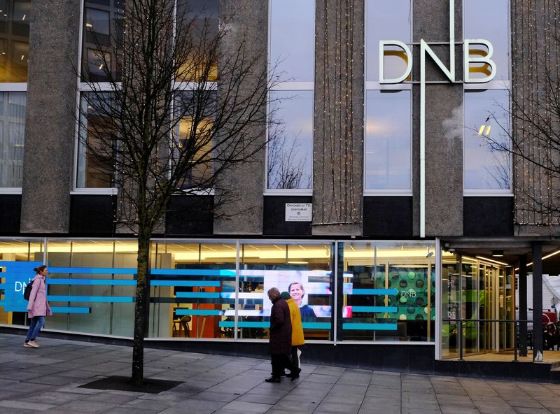 &copy; Reuters. People walk past DNB bank branch in Stavanger, Norway December 5, 2019. REUTERS/Ints Kalnins/ File Photo