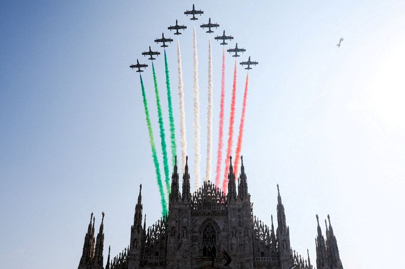 &copy; Reuters. FILE PHOTO: The Duomo Cathedral is seen as the aerobatic demonstration team of the Italian Air Force the "Frecce Tricolori" (Tricolor Arrows) performs to mark the 100th anniversary of the foundation of the Italian military's air forces in Milan, Italy, Se