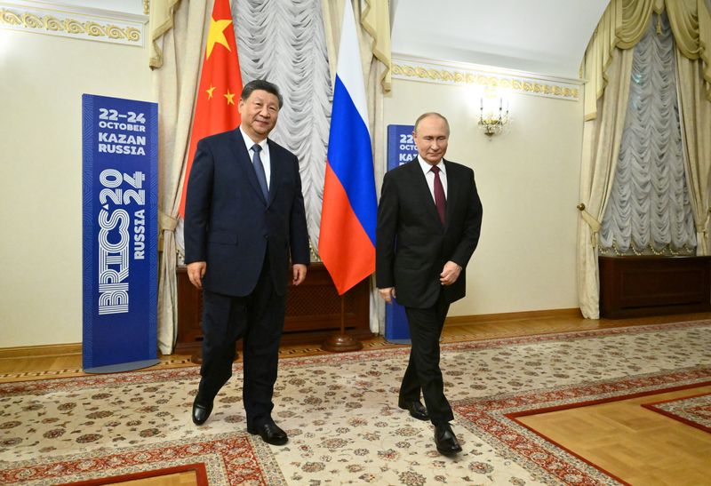 &copy; Reuters. Russian President Vladimir Putin and Chinese President Xi Jinping walk during a meeting on the sidelines of the BRICS Summit in Kazan, Russia October 22, 2024. Kristina Kormilitsyna/BRICS-RUSSIA2024.RU Host Photo Agency via REUTERS