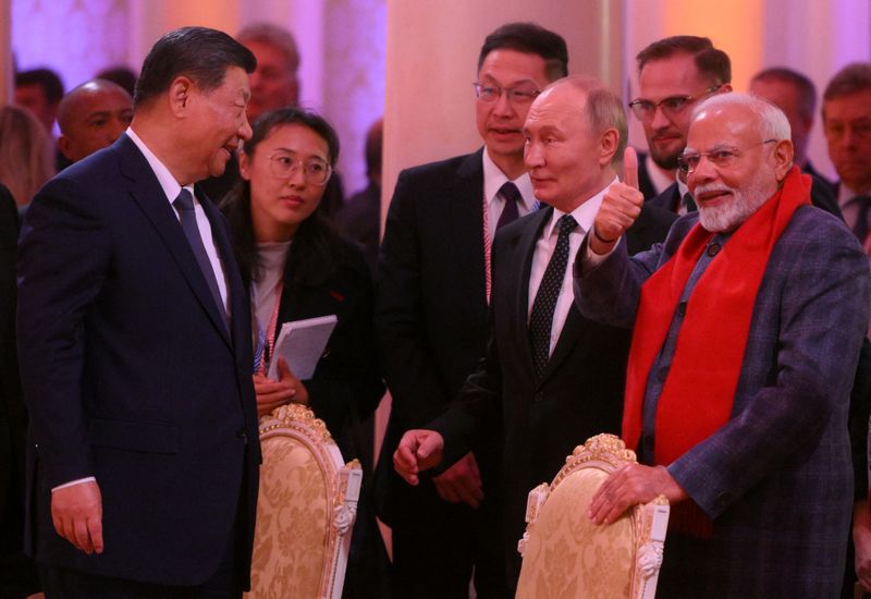 © Reuters. Chinese President Xi Jinping, Russian President Vladimir Putin and Indian Prime Minister Narendra Modi attend a concert before an informal dinner on the sidelines of the BRICS Summit in Kazan, Russia October 22, 2024. Alexander Kryazhev/BRICS-RUSSIA2024.RU Host Photo Agency via REUTERS