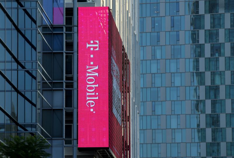 &copy; Reuters. FILE PHOTO: A T-Mobile logo is advertised on a building sign in Los Angeles, California, U.S., May 11, 2017. REUTERS/Mike Blake/File Photo