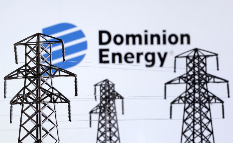 © Reuters. FILE PHOTO: Electric power transmission pylon miniatures and Dominion Energy logo are seen in this illustration taken, December 9, 2022. REUTERS/Dado Ruvic/Illustration/File Photo