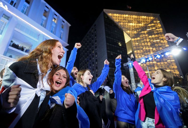 &copy; Reuters. Supporters of the Georgian Dream party celebrate at the party's headquarters after the announcement of exit poll results in parliamentary elections, in Tbilisi, Georgia October 26, 2024. REUTERS/Irakli Gedenidze     TPX IMAGES OF THE DAY