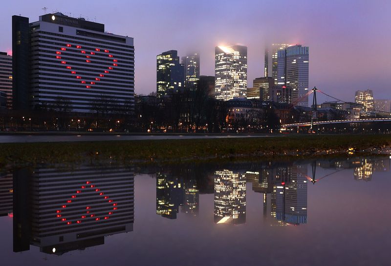 &copy; Reuters. The high-rise buildings of financial district disappearing in clouds are reflected in a puddle in Frankfurt, Germany, February 2, 2021.  REUTERS/Kai Pfaffenbach/File Photo