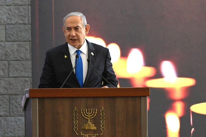 &copy; Reuters. Israeli Prime Minister Benjamin Netanyahu speaks at a memorial ceremony for those murdered by Hamas on October 7, 2023, and those who fell in the "Iron Sword" war, at the Knesset, the Parliament, in Jerusalem, on Monday, October 28, 2024. DEBBIE HILL/Pool