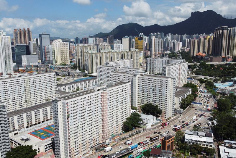 © Reuters. FILE PHOTO: An aerial view shows Choi Hung public housing estate and other residential buildings with the Lion Rock peak in the background, in Hong Kong, China June 3, 2021. Picture taken June 3, 2021 with a drone. REUTERS/Joyce Zhou/File Photo