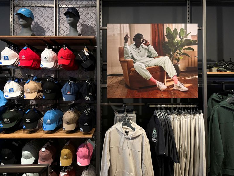 © Reuters. FILE PHOTO: Adidas merchandise is seen in an Adidas store on the day the German company terminated its partnership with the American rapper and designer Kanye West, now known as Ye, in Garden City, New York, U.S., October 25, 2022.  REUTERS/Shannon Stapleton/File Photo