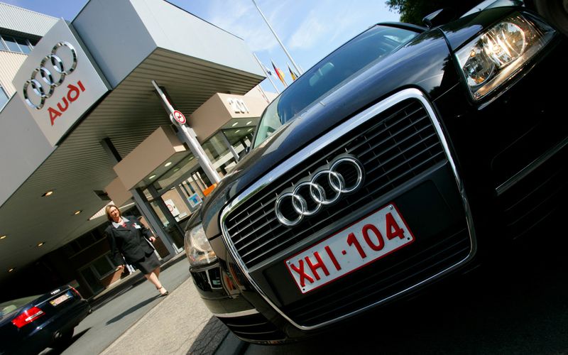 &copy; Reuters. FILE PHOTO: A woman walks past the entrance of the new Audi plant in Brussels May 30, 2007.  REUTERS/Yves Herman/File Photo