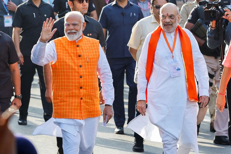 &copy; Reuters. India's Prime Minister Narendra Modi walks alongside Amit Shah, Indian Home Minister and leader of India's ruling Bharatiya Janata Party (BJP) on the day he casts his vote in Ahmedabad, India, May 7, 2024. REUTERS/Adnan Abidi/File Photo