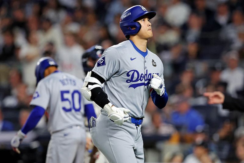 &copy; Reuters. Oct 30, 2024; New York, New York, USA; Los Angeles Dodgers two-way player Shohei Ohtani (17) runs back to the dugout after grounding out during the seventh inning against the New York Yankees in game four of the 2024 MLB World Series at Yankee Stadium. Ma