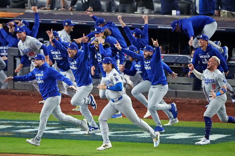 © Reuters. Oct 30, 2024; New York, New York, USA; Los Angeles Dodgers two-way player Shohei Ohtani (17) and the Los Angeles Dodgers celebrate after beating the New York Yankees in game four to win the 2024 MLB World Series at Yankee Stadium. Mandatory Credit: Robert Deutsch-Imagn Images