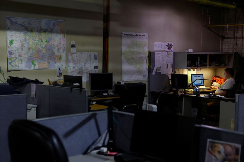 &copy; Reuters. An election worker sits inside the Allegheny County Elections Warehouse in Pittsburgh, Pennsylvania, U.S., October 30, 2024. REUTERS/Shannon Stapleton