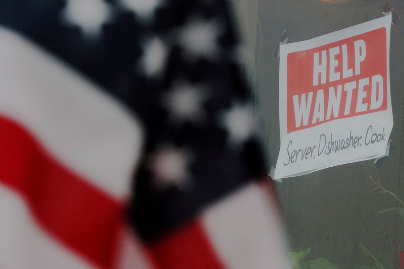 &copy; Reuters. FILE PHOTO: A "Help Wanted" sign hangs in restaurant window in Medford, Massachusetts, U.S., January 25, 2023. REUTERS/Brian Snyder/File Photo