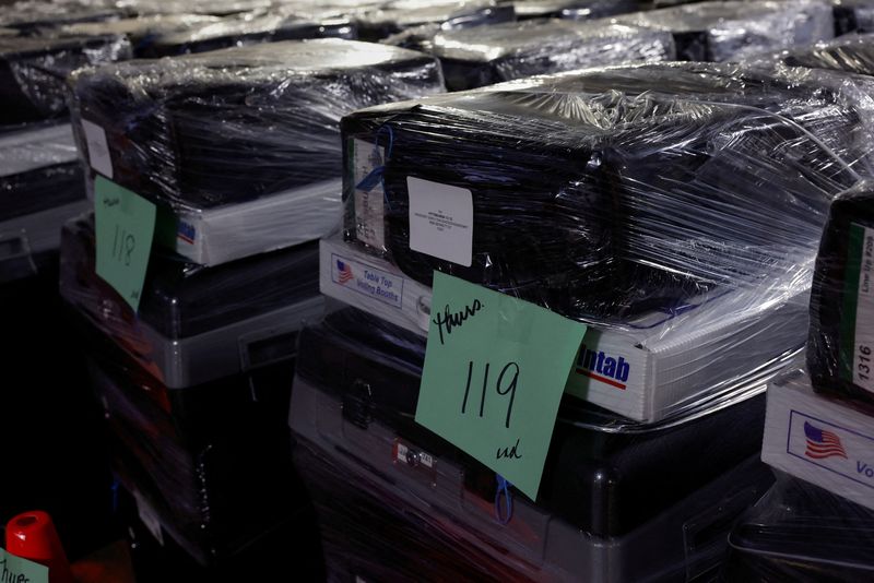 © Reuters. FILE PHOTO: Wrapped voting machines wait for delivery inside the Allegheny County Elections Warehouse in Pittsburgh, Pennsylvania, U.S., October 30, 2024. REUTERS/Shannon Stapleton/File Photo