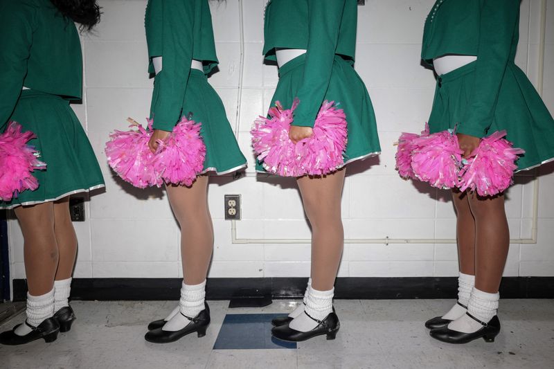 © Reuters. Alpha Kappa Alpha Sorority, Incorporated members stand in line before their performance at the Greek Step Show in Burr Gymnasium, during Howard University's 100th Homecoming in Washington, D.C., U.S., October 18, 2024. Homecomings at HBCUs, once the only places where Black Americans could pursue higher education, are now weekend-long celebrations of Black culture, tradition, school pride and community spirit. 