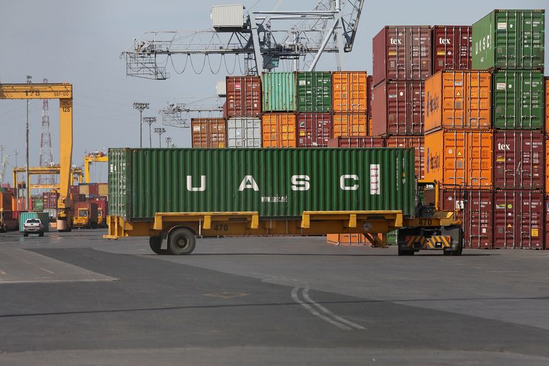 &copy; Reuters. FILE PHOTO: A shipping container is unloaded in the Port of Montreal in Montreal, Quebec, Canada, May 17, 2021.  REUTERS/Christinne Muschi/File Photo