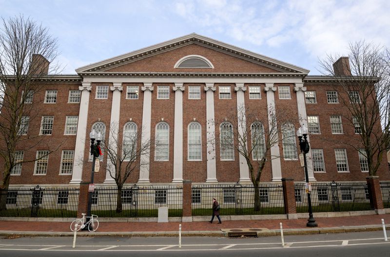 &copy; Reuters. FILE PHOTO: An unidentified person walks past Harvard yard at Harvard University in Cambridge, Massachusetts, U.S., December 7, 2023 as leaders of various universities come under fire from their schools' Jewish communities for their handling of clashes be