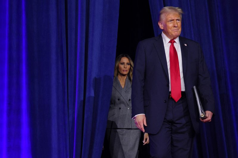 &copy; Reuters. Republican presidential nominee and former U.S. President Donald Trump and his wife Melania take the stage for his election night rally at the Palm Beach County Convention Center in West Palm Beach, Florida, U.S., November 6, 2024. REUTERS/Brian Snyder/Fi