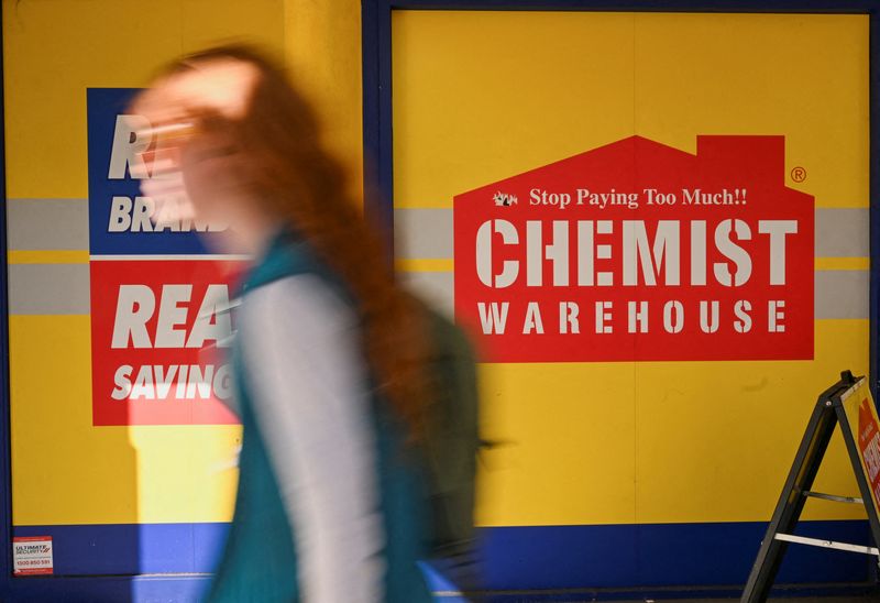 © Reuters. FILE PHOTO: A woman walks past a Chemist Warehouse store in Sydney, Australia, July 3, 2024. REUTERS/Jaimi Joy/File Photo