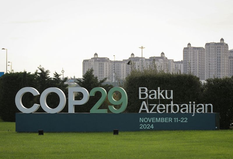 &copy; Reuters. FILE PHOTO: A view shows a sign of the COP29 United Nations Climate Change Conference with a backdrop of the cityscape in Baku, Azerbaijan October 31, 2024. REUTERS/Aziz Karimov/File Photo