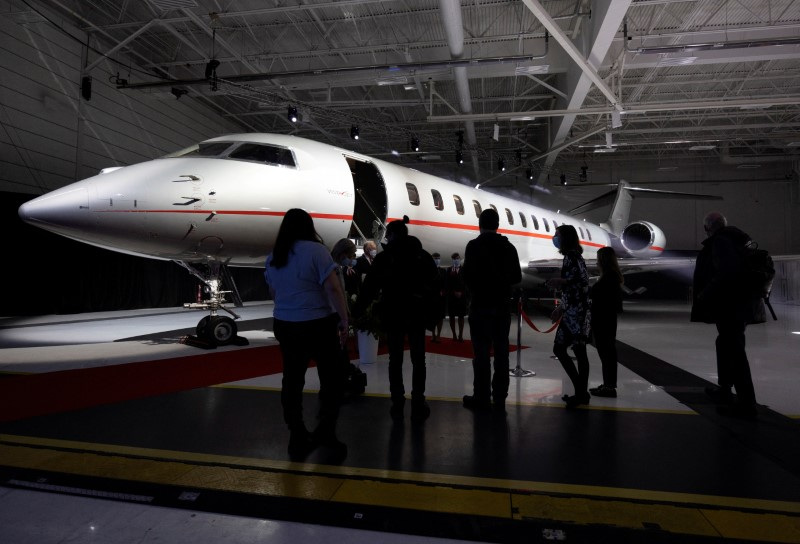 &copy; Reuters. FILE PHOTO: Members of the media wait to tour the interior of a new Bombardier Global 7500 business jet as the company celebrates its 10th delivery of this aircraft to VistaJet in Montreal, Quebec, Canada March 29, 2022.  REUTERS/Christinne Muschi/File Ph