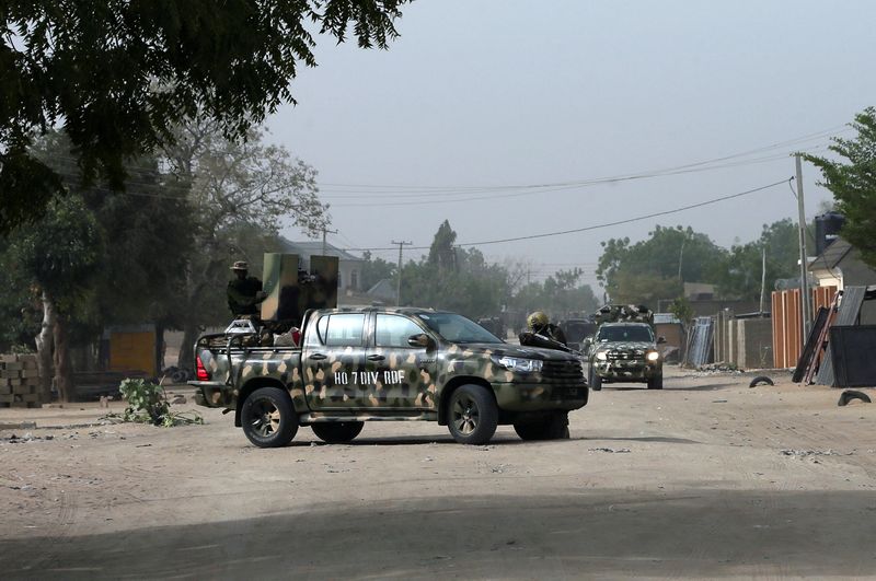 &copy; Reuters. FILE PHOTO: Nigerian military secure the area where a man was killed by suspected militants during an attack around Polo area of Maiduguri, Nigeria February 16, 2019. REUTERS/Afolabi Sotunde/File Photo